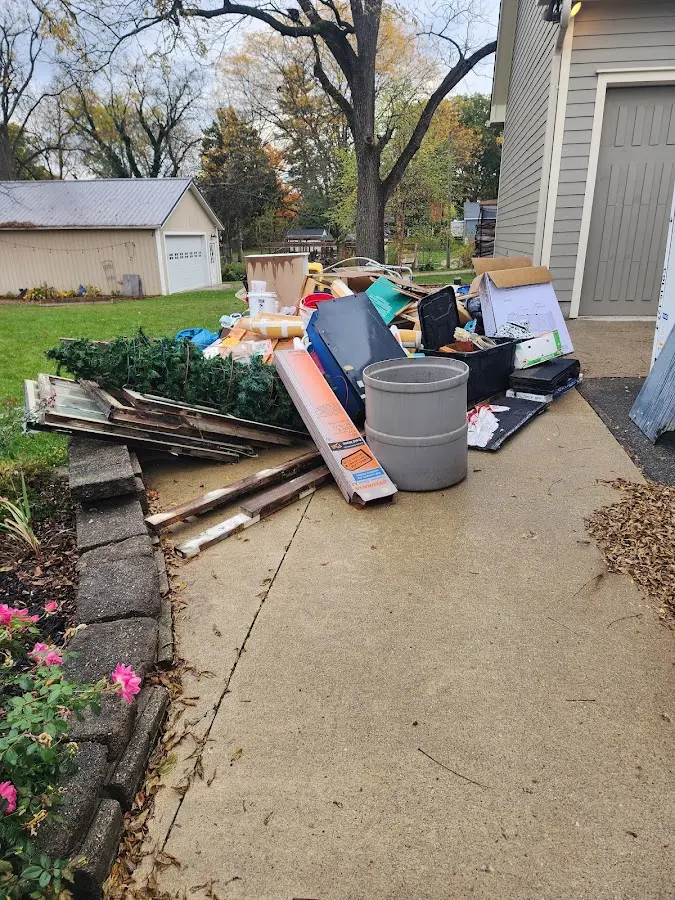 Dumpster being loaded with debris for Residential Dumpster Rental in Kenosha